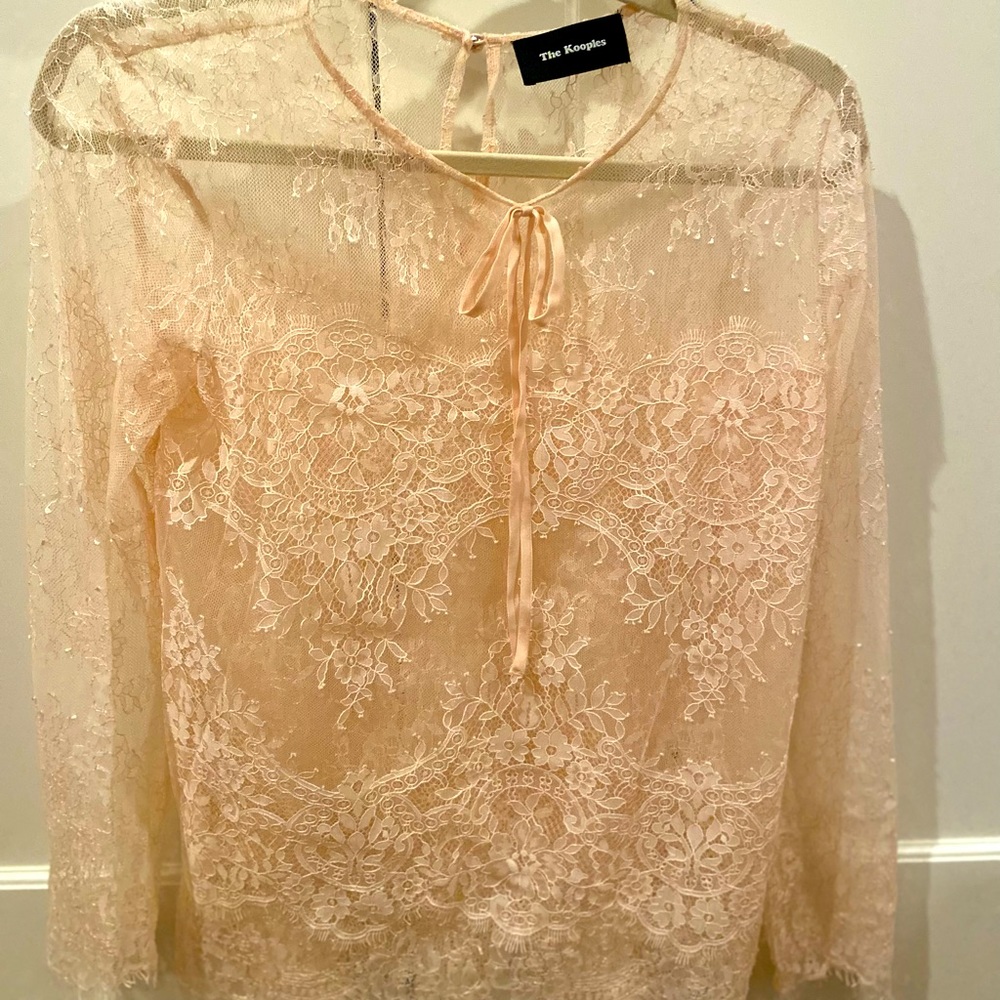 Lace detail blush colored blouse
